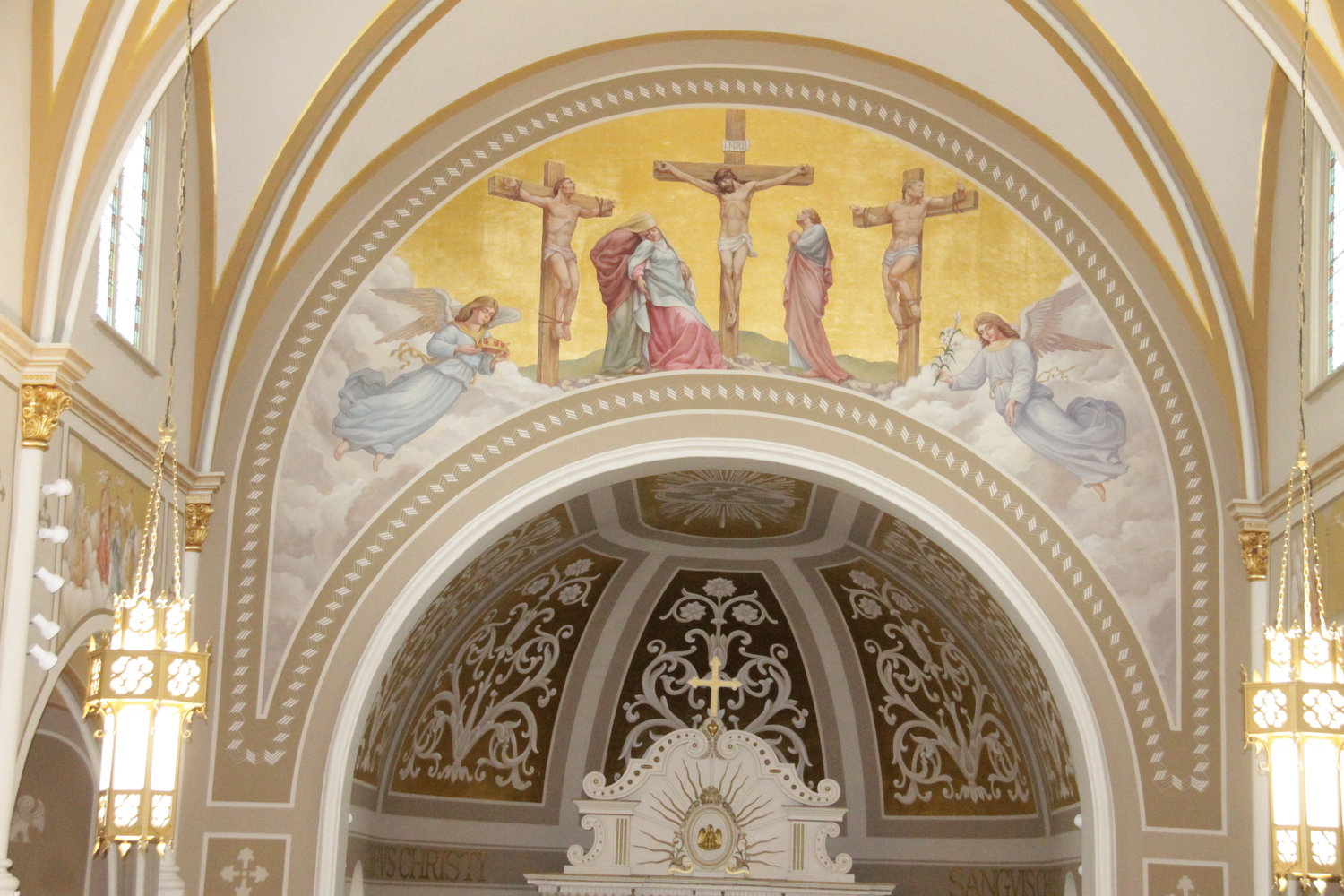 This nearly 25-foot-wide, gilded mural depicting the Crucifixion adorns the chancel arch above the altar in St. Joseph Church in Westphalia. It is part of a nearly completed, massive renovation of the church.