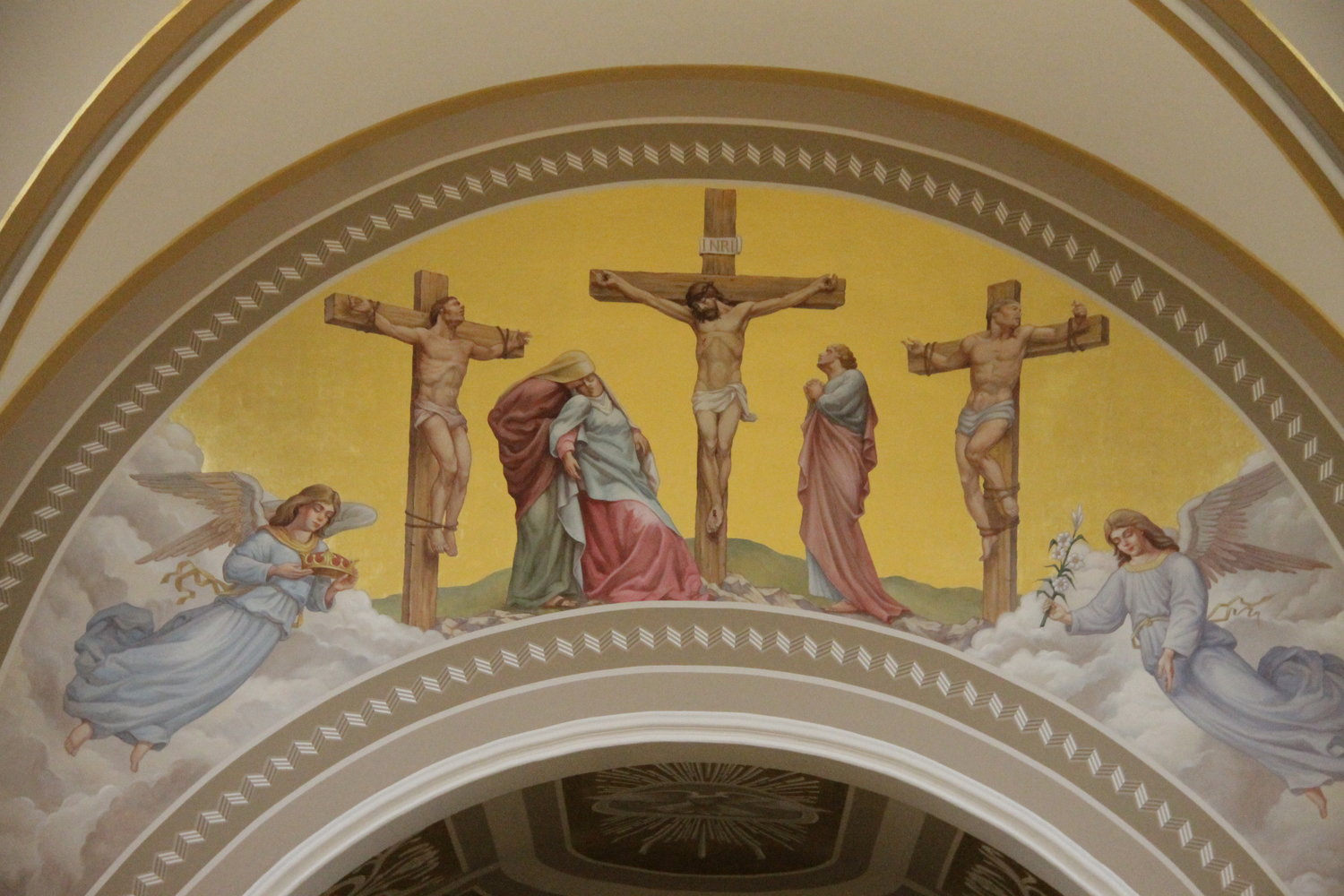 This nearly 25-foot-wide, gilded mural depicting the Crucifixion adorns the chancel arch above the altar in St. Joseph Church in Westphalia. It is part of a nearly completed, massive renovation of the church.