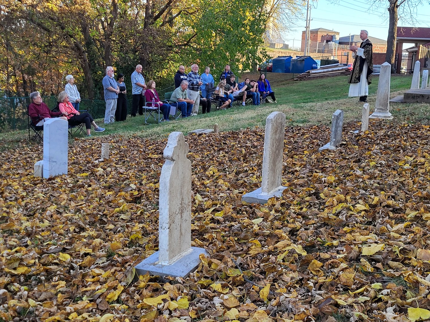 Father Jeremy Secrist, pastor of St. Peter Parish in Jefferson City, offers Mass in the recently restored St. Peter Cemetery 1, in which burials took place from the 1840s until about 1880, on All Souls Day.